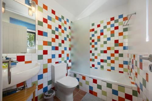 a bathroom with a toilet and a sink at Apartment Amado - Carrapateira in Carrapateira