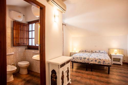 a bedroom with a bed and a tub and a sink at Villa Sole Pula in Pula