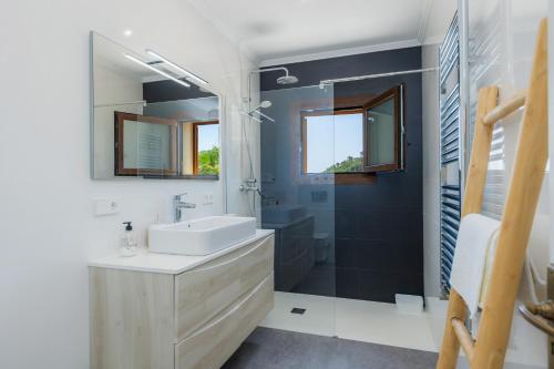 a bathroom with a sink and a shower at Sestel in Capdepera