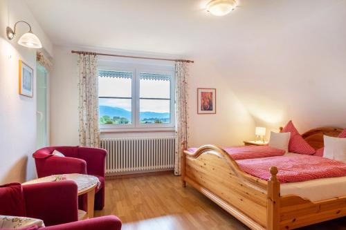 a bedroom with a wooden bed and a window at Haus Scherer in Sankt Peter
