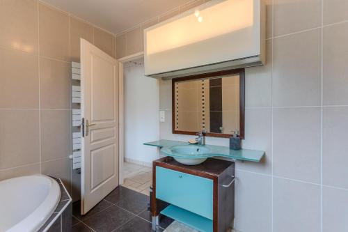 a bathroom with a sink and a toilet at Gite Gousseau in Buzy