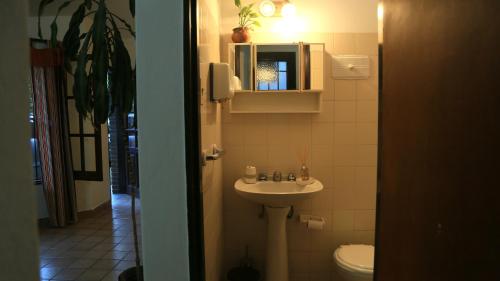 a bathroom with a sink and a toilet at El Aromito in Jesús María