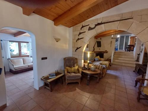 a living room with a couch and a table at Casa Vista Monte in Llucmajor