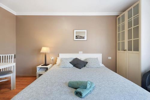 a bedroom with a bed with two pillows on it at La Quinta in Santa Úrsula
