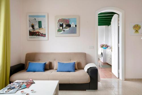 a living room with a couch and a table at Apartamento Rocas Negras in Puerto del Carmen