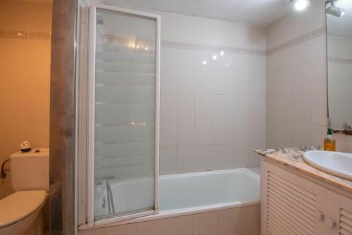 a bathroom with a shower and a toilet and a sink at Can Quintaneta in Begur