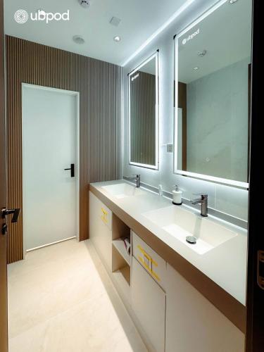 a bathroom with a sink and a mirror at UBPOD- The First Capsule Hotel in Mongolia in Ulaanbaatar