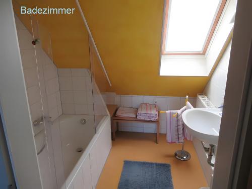a bathroom with a sink and a shower and a sink at Ferienwohnung Stine in Stetten
