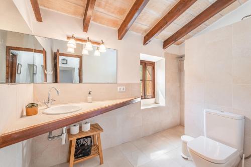 a bathroom with a sink and a toilet at Can Faveta in Alcudia