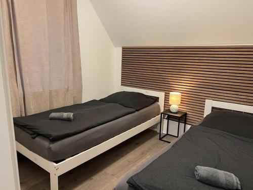 a bedroom with two beds and a window at Wohnung mit Fernblick in Jübek