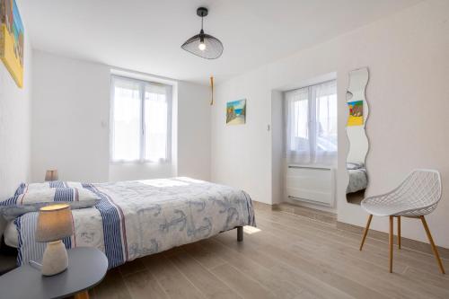מיטה או מיטות בחדר ב-Appartement Penfret Plain-pied