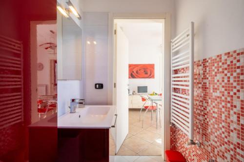 a bathroom with a tub and a sink and a table at Villa Olga in Nardò