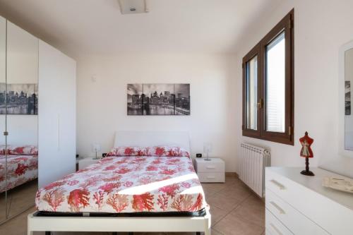 a bedroom with a bed and a window at Villa Olga in Nardò