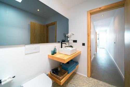 a bathroom with a sink and a mirror at Kay lava in Famara