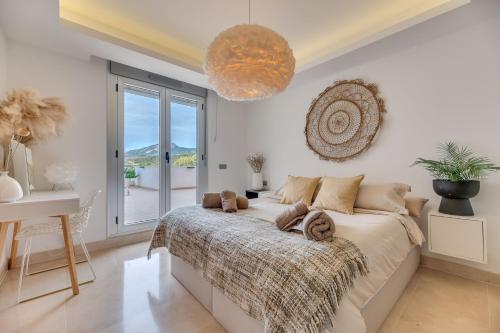 a bedroom with a bed and a large window at Avalon in Benahavís