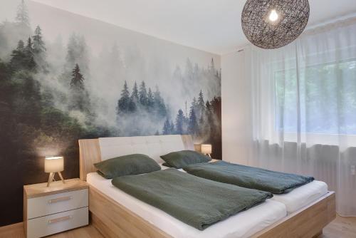 a bedroom with a bed with a painting on the wall at Schwarzwald-Kitz mit Pool und Sauna in Lenzkirch