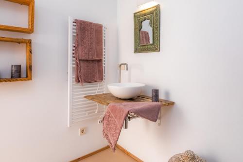 a bathroom with a bowl sink on a counter at Pep Not 47 in Artá