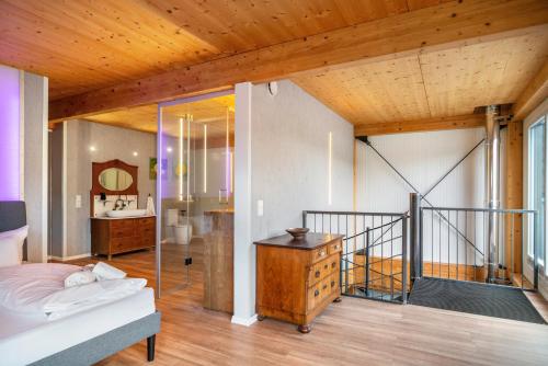 a bedroom with a bed and a bathroom at Moselbude Cube mit Sauna in Traben-Trarbach