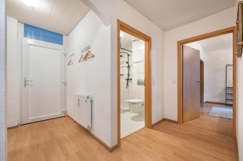 an open hallway with a toilet and a bathroom at Fewo Das Spatzennest in Bad Harzburg