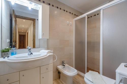 a bathroom with a sink and a toilet and a shower at Fidalsa Bay View Romance in Guardamar del Segura