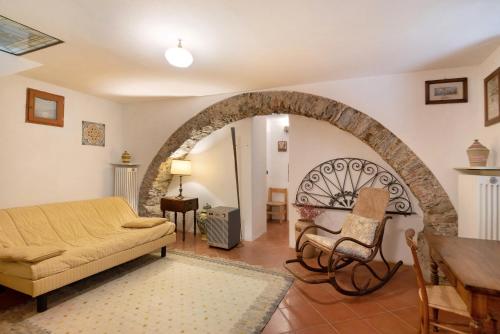 a living room with a couch and a chair at Casa di Gina in Levanto
