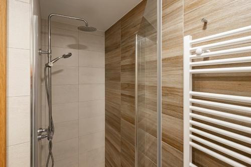 a shower with a glass door in a bathroom at 2 Jardin 1 - Toró in Llanes