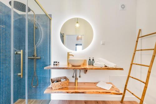 a bathroom with a sink and a shower at Ocean View Villas in Caniço