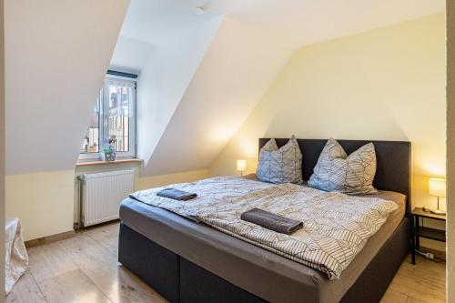 a bedroom with a large bed in a attic at Ferienwohnung F Bolanz 1 in Auggen