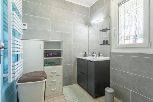 a bathroom with a toilet and a sink at Chambre d'hôtes in Lorgues