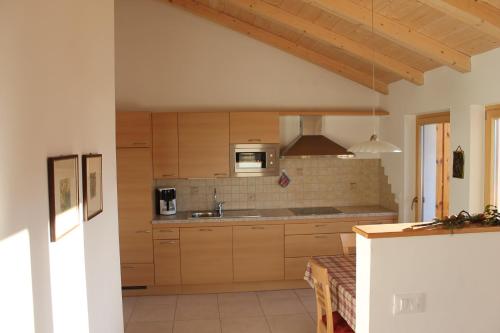 a kitchen with a sink and a microwave at Pföslhof in Laives