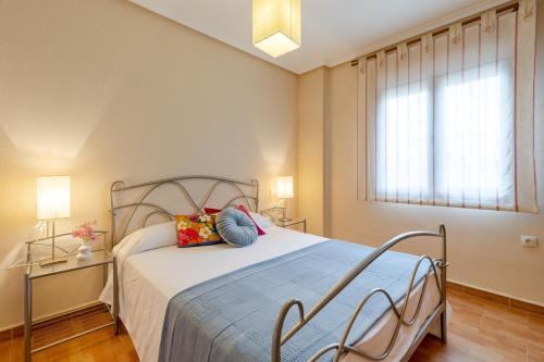 a bedroom with a large bed and a window at Mountain Beautiful by Fidalsa in Busot