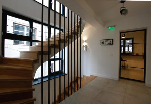 a staircase in a house with glass windows at The Pines Boutique Villa in Braşov