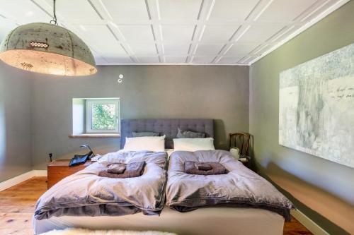 a bedroom with a bed with two pillows on it at Ferienwohnung auf dem Wald 4 Per in Görwihl