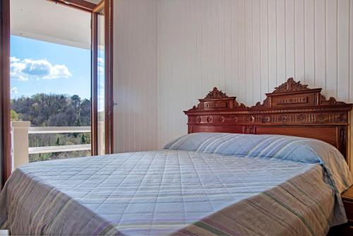 a bedroom with a bed and a large window at Home Pier in Laveno-Mombello