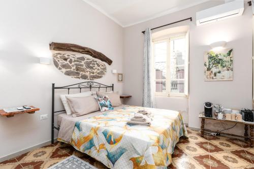 a bedroom with a bed and a window at Gustalu in Dorgali