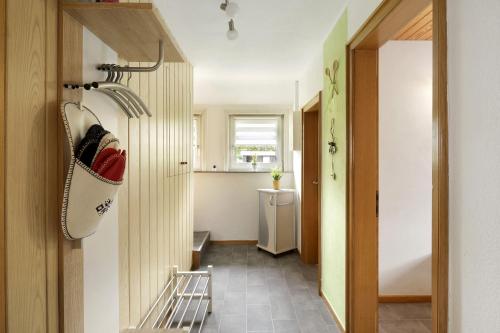 a room with a hallway with a hat on the door at Tati's Ferienwohnung Siegerland in Hilchenbach