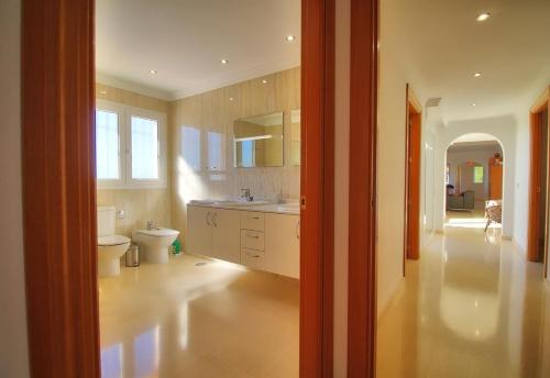 a bathroom with a toilet and a sink at Luxurius Villa with private pool in Mijas