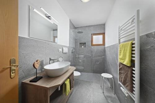 a bathroom with a sink and a shower at Langeshof Fewo Morgensonne in Caines