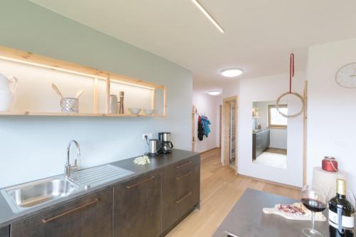 a kitchen with a sink and a counter top at Ferienwohnung Berg Wieserhof in Aldino