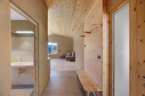 a bathroom with a sink and a mirror at Pitschlhof Apt Zirbe in Aldino