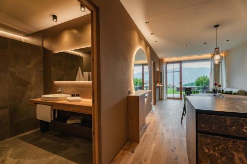 a kitchen with a sink and a counter top at Valentinerhof Apt Terra in San Michele