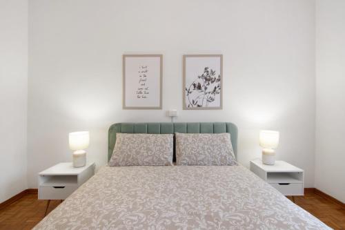 a bedroom with a bed with two night stands at Palma’s house in Dongo