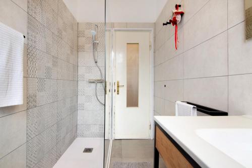 a bathroom with a shower and a sink at Palma’s house in Dongo