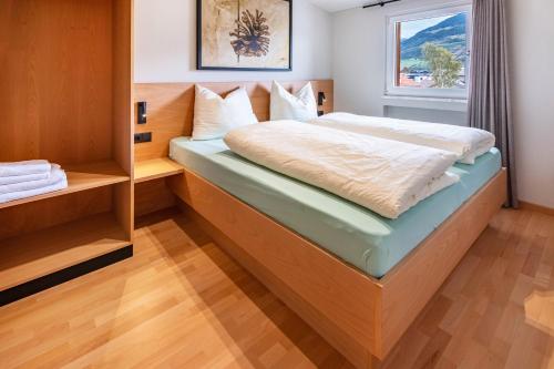 a bedroom with a bed and a window at Ferienwohnung Hans in Prato allo Stelvio