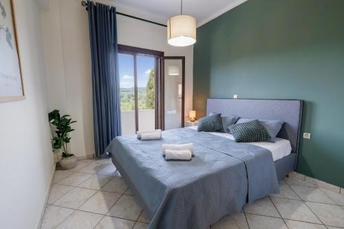 a bedroom with a bed with two towels on it at Breathing Apartment in Virós