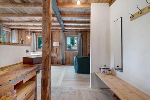 a large room with wooden floors and wooden ceilings at Wellness Chalet Samer in Sarntal