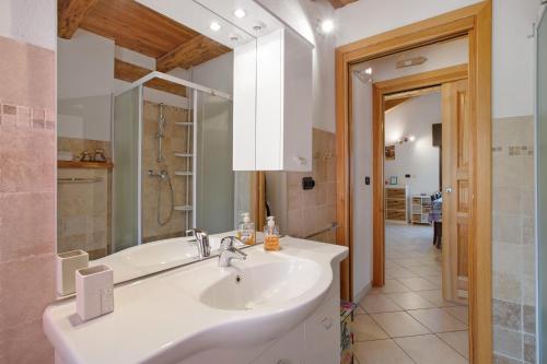 a bathroom with a sink and a bath tub at Casa Michod - Nonno Marcel in Châtillon