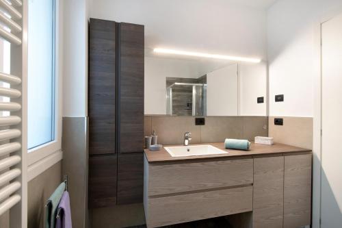 a bathroom with a sink and a mirror at Casa Andrea in Gera Lario
