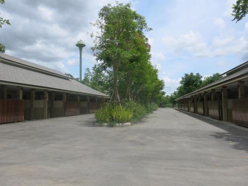 an empty parking lot next to a building at SP Park Cha-am in Cha Am
