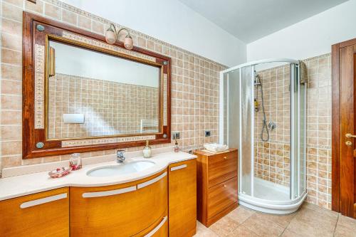 a bathroom with a sink and a shower at Villa Del Riccio in Magione